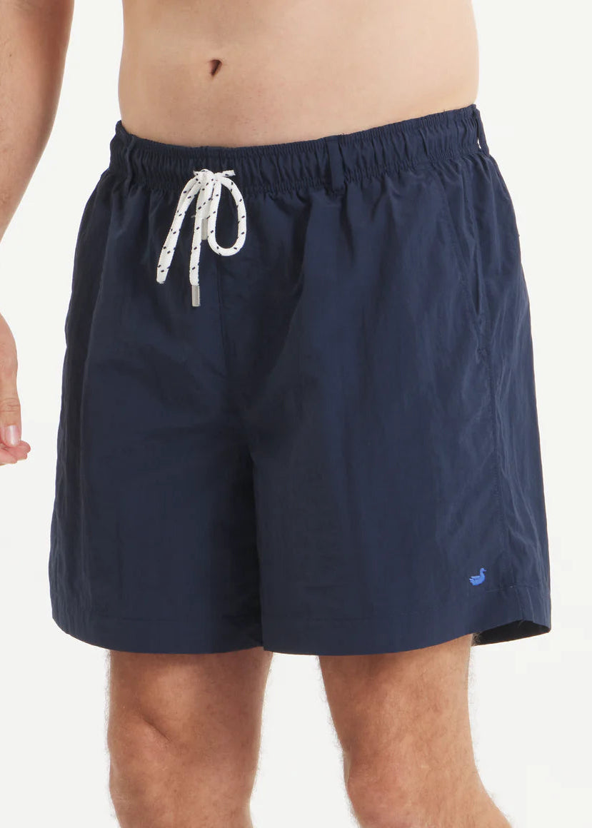 Navy blue swim shorts with a drawstring on a white background